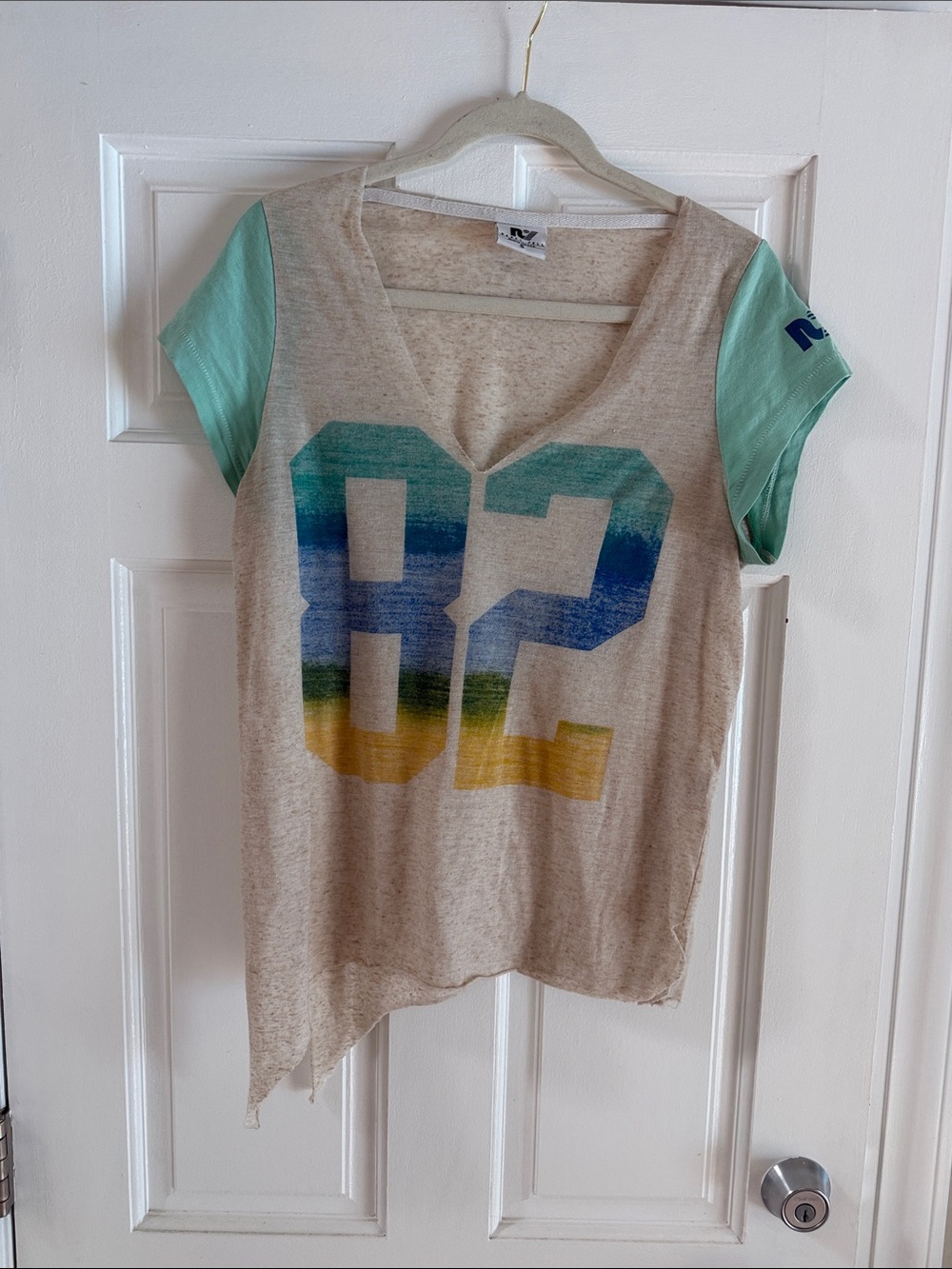 Rebel Yell Beige V-Neck Tee with Mint Sleeves and Striped '82 Graphic
